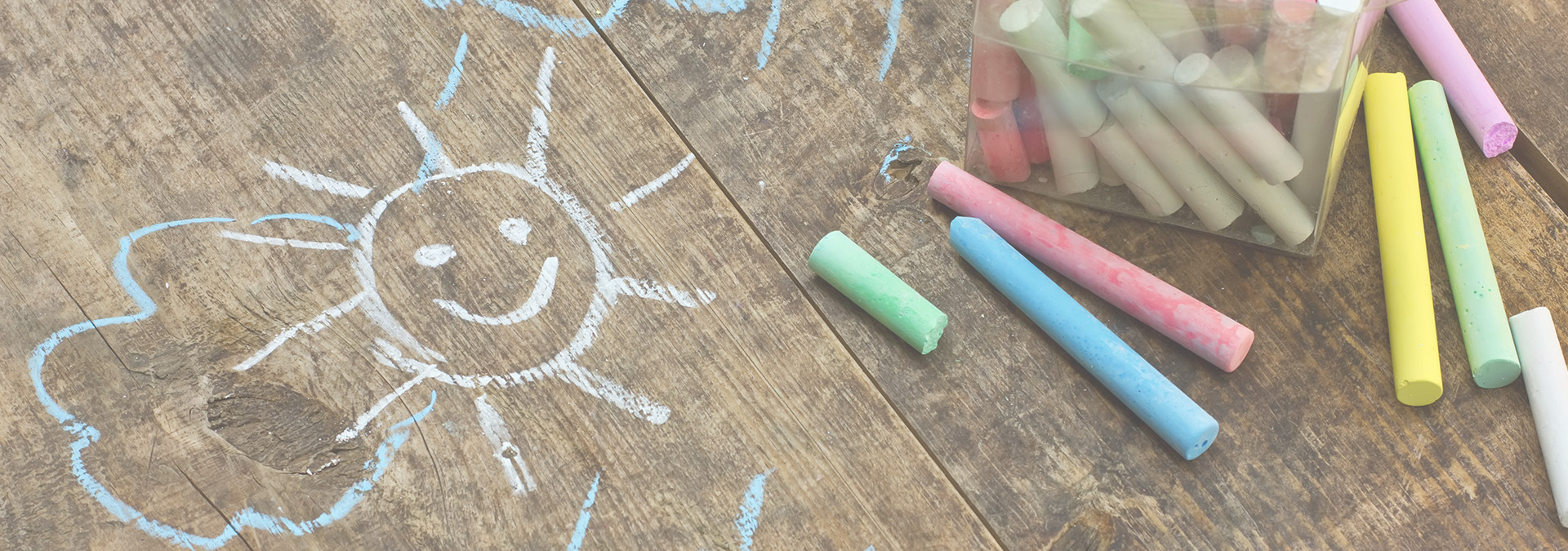 Chalk sun drawing and colourful chalk sticks