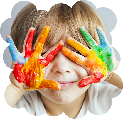Smiling child with colourful painted hands